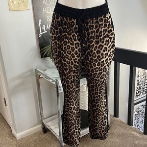 Like new leopard print pants w/ black stripe